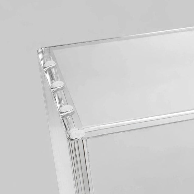 A clear acrylic display box with beveled edges and the brand name 'CoralGuard' printed on one side, shown on a neutral gray background.