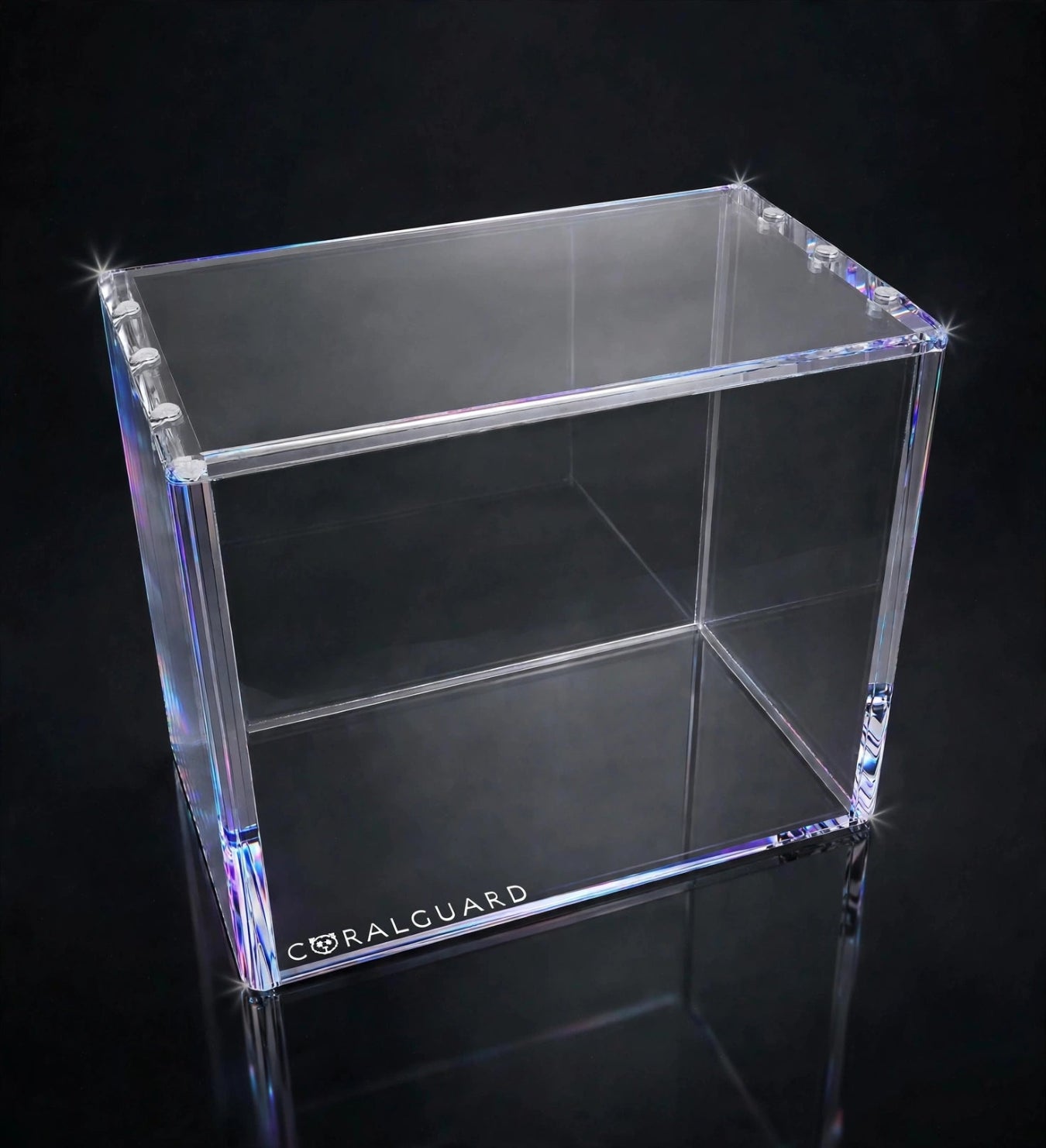 A clear acrylic display box with a dual-layer design, featuring the Coralguard brand name printed on the bottom edge, set against a dark reflective background.